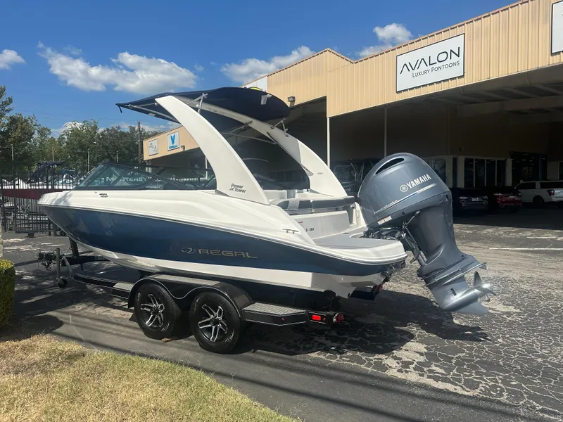 Slide: The Image of 2023 Regal 21 OBX boat with Yamaha engine parked outside Avalon building. - 8