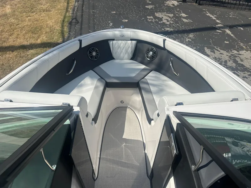 Slide: The Image of 2023 Regal 21 OBX boat interior with cushioned seating and speakers. - 9