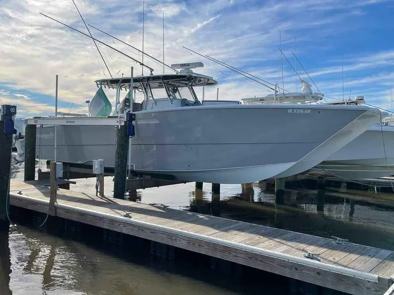 Slide: The Image of Freeman 42 LR 2020 boat docked at marina under a blue sky. - 11