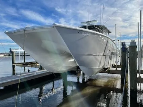 Slide: The Image of 2020 Freeman 42 LR boat docked at marina under clear blue sky. - 22
