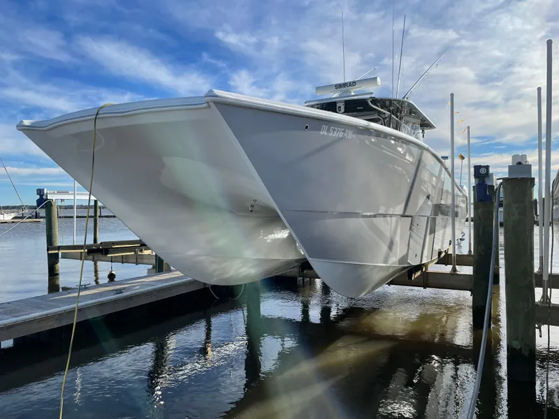 Slide: The Image of 2020 Freeman 42 LR boat docked at marina under clear blue sky. - 31