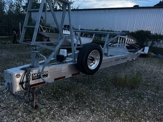 Slide: The Image of Trailer for Freeman 42 LR boat, 2020 model, parked on gravel. - 6