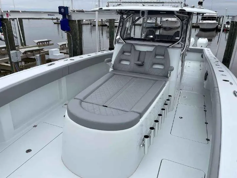 Slide: The Image of 2020 Freeman 42 LR boat with spacious deck and seating at a marina. - 7