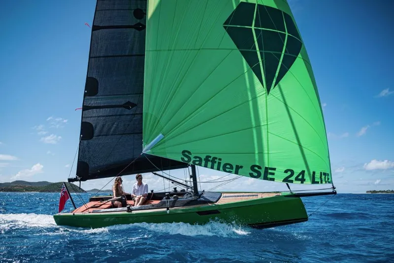 The Image of 2026 Saffier 24 Lite sailboat with green sail on open water, sunny day. - 0