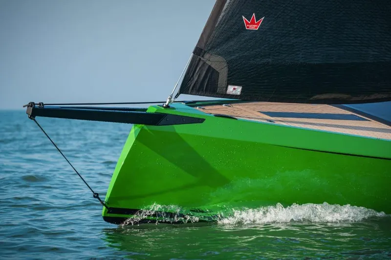 Slide: The Image of Saffier 24 Lite 2026 sailboat with vibrant green hull on the water. - 6