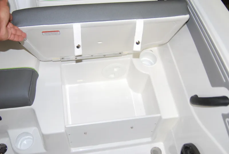 Slide: The Image of 2024 Tahoe T21 boat storage compartment with open seat lid. - 11