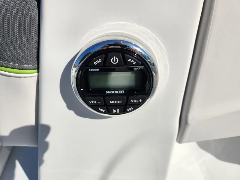 Slide: The Image of 2024 Tahoe T16 boat audio control panel with Kicker stereo system. - 13