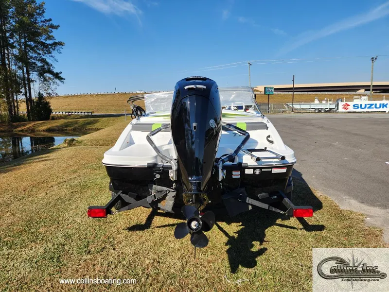 Slide: The Image of 2024 Tahoe T16 boat rear view with outboard motor in outdoor setting. - 2