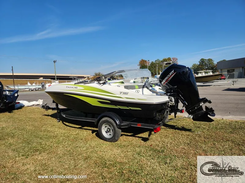 Slide: The Image of 2024 Tahoe T16 boat with Mercury outboard motor on trailer, displayed outdoors. - 3