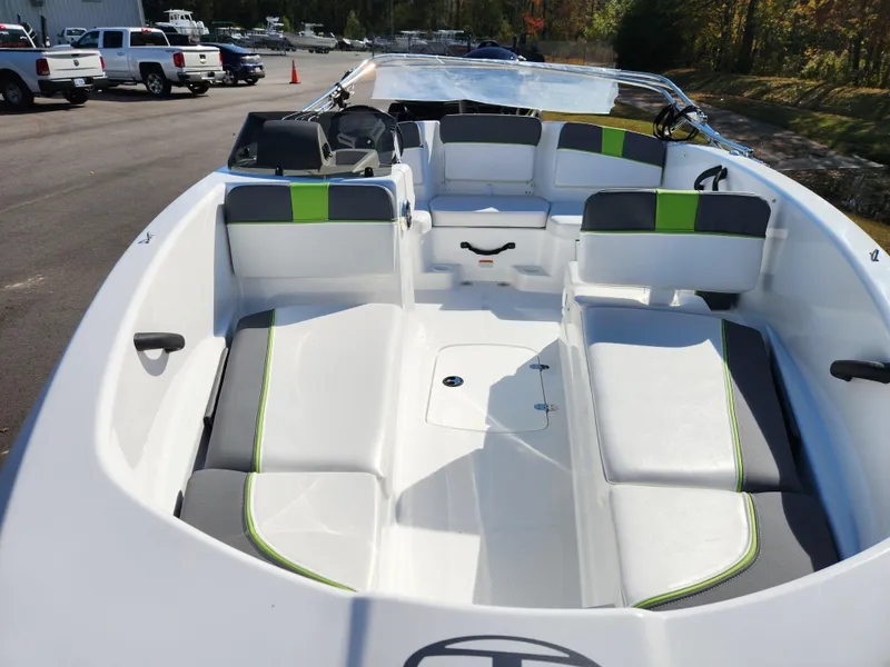 Slide: The Image of 2024 Tahoe T16 boat interior with white and green seating. - 6