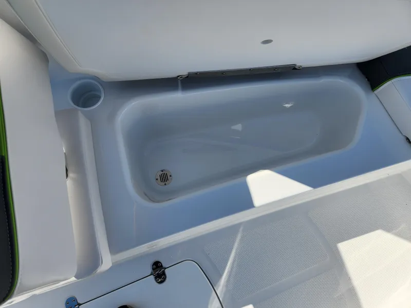 Slide: The Image of 2024 Tahoe T16 boat interior storage compartment with drain. - 7