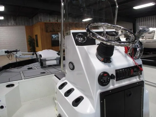 Slide: The Image of 2024 Crestliner 1800 Bay boat console with steering wheel and controls. - 5