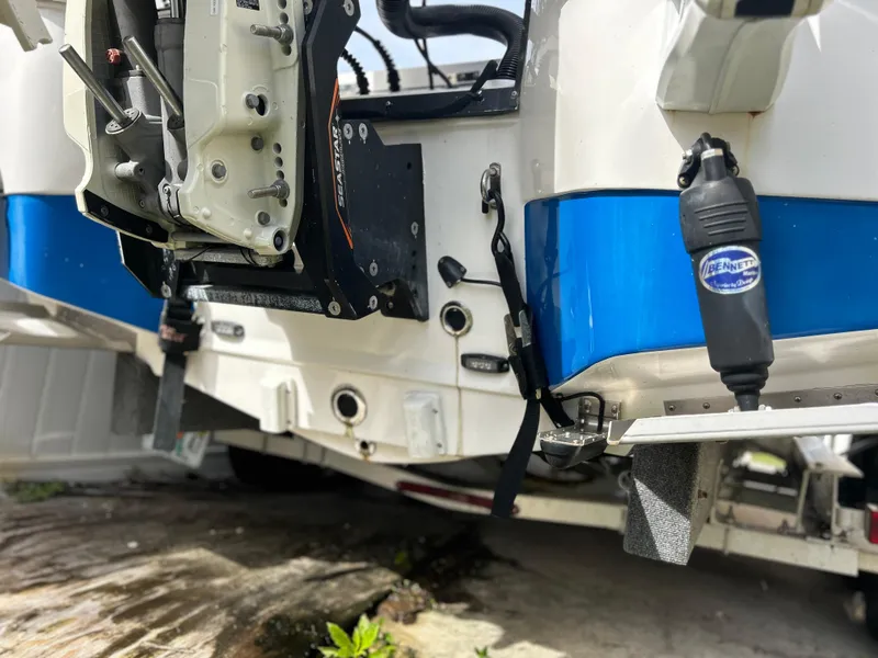 Slide: The Image of 2020 Aquasport 244 Bay boat stern with motor and trailer. - 10