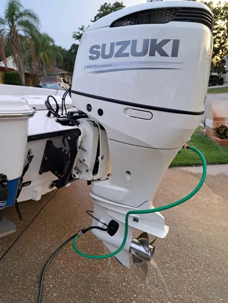 Slide: The Image of 2020 Aquasport 244 Bay with Suzuki outboard motor. - 18