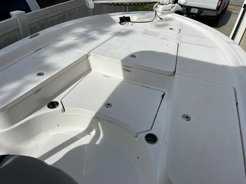 Slide: The Image of 2020 Aquasport 244 Bay boat deck with storage compartments. - 23