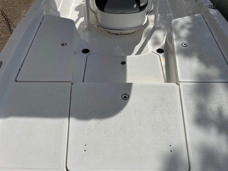 Slide: The Image of 2020 Aquasport 244 Bay boat deck with storage compartments. - 25