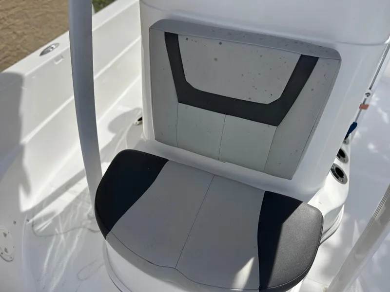 Slide: The Image of 2020 Aquasport 244 Bay boat seat with white and black upholstery. - 27