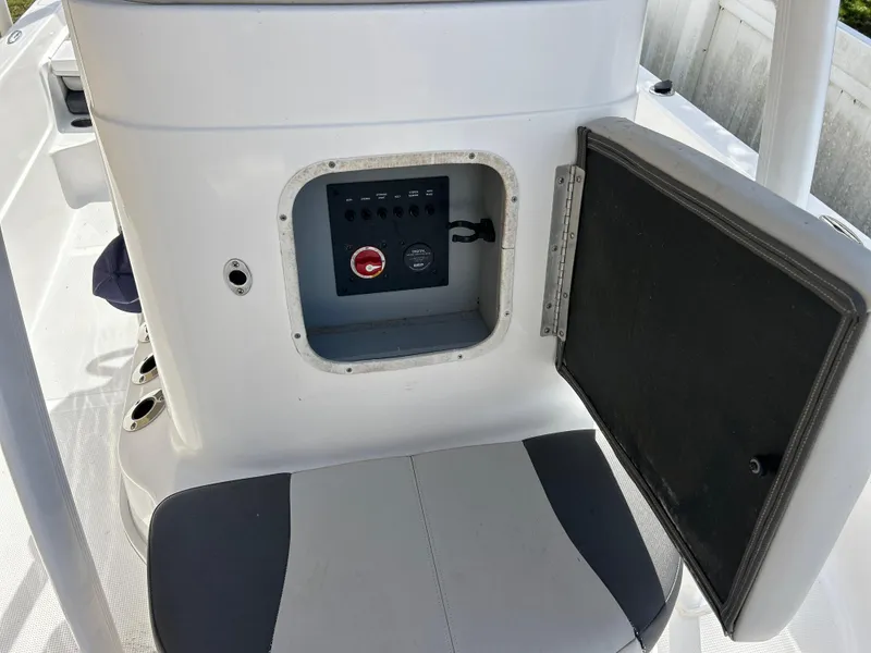 Slide: The Image of 2020 Aquasport 244 Bay boat console with open storage compartment. - 28