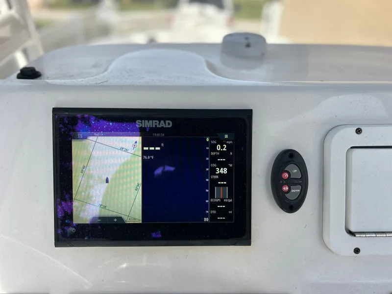 Slide: The Image of Simrad navigation system on a 2020 Aquasport 244 Bay boat. - 35