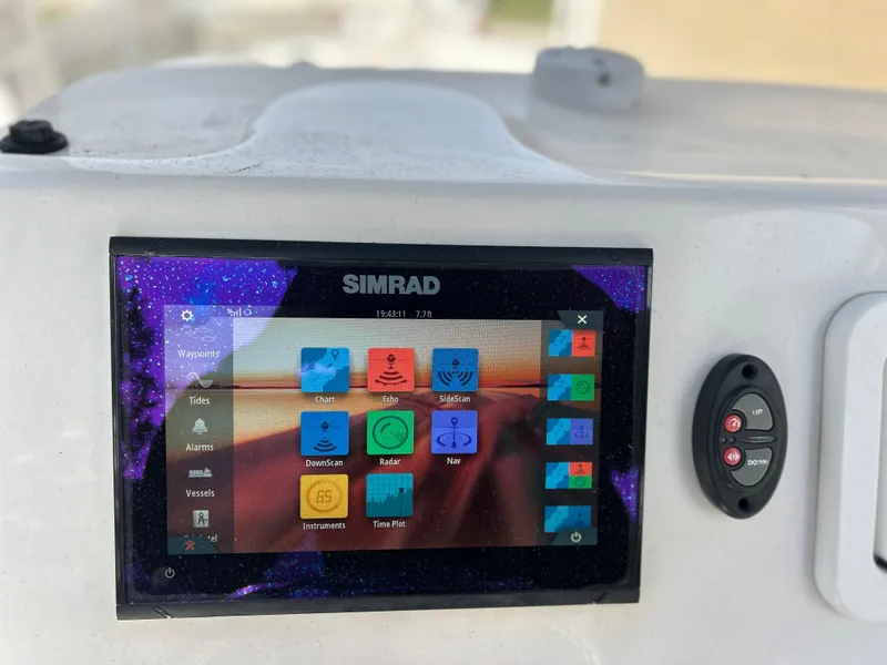 Slide: The Image of Simrad navigation display on 2020 Aquasport 244 Bay boat. - 36