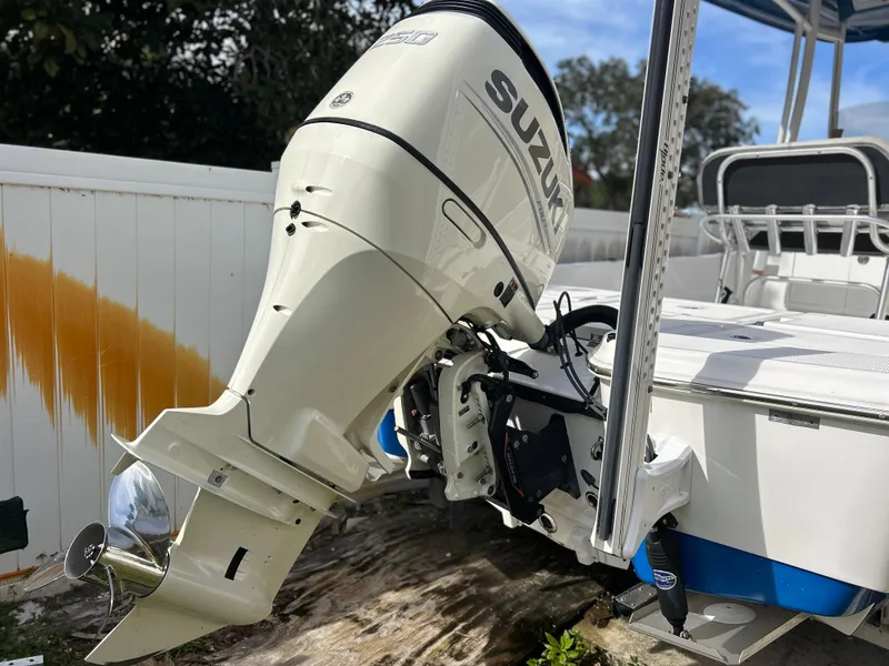 Slide: The Image of 2020 Aquasport 244 Bay boat with Suzuki outboard motor. - 4