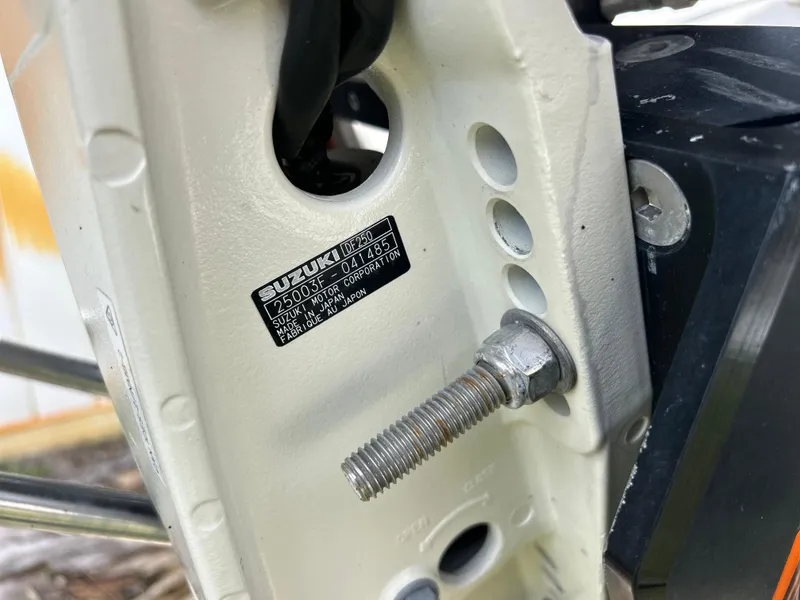 Slide: The Image of Close-up of Suzuki engine part on 2020 Aquasport 244 Bay boat. - 46