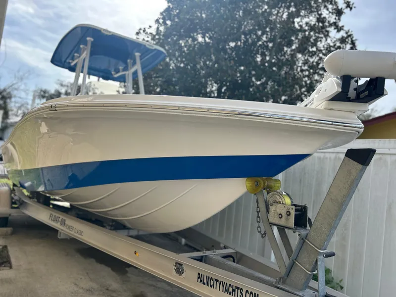 Slide: The Image of 2020 Aquasport 244 Bay boat on trailer, side view. - 5