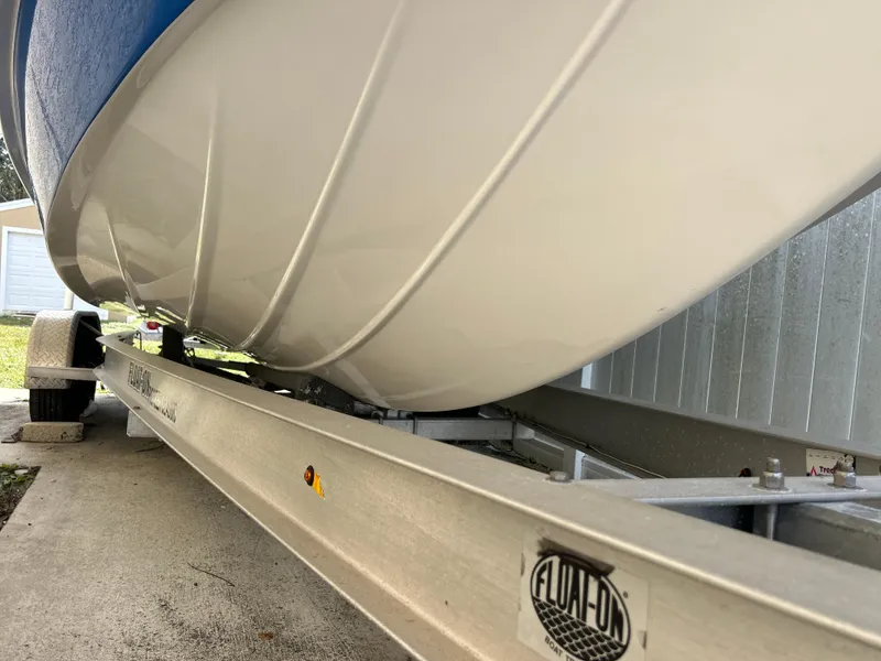 Slide: The Image of 2020 Aquasport 244 Bay boat on trailer, close-up view. - 6