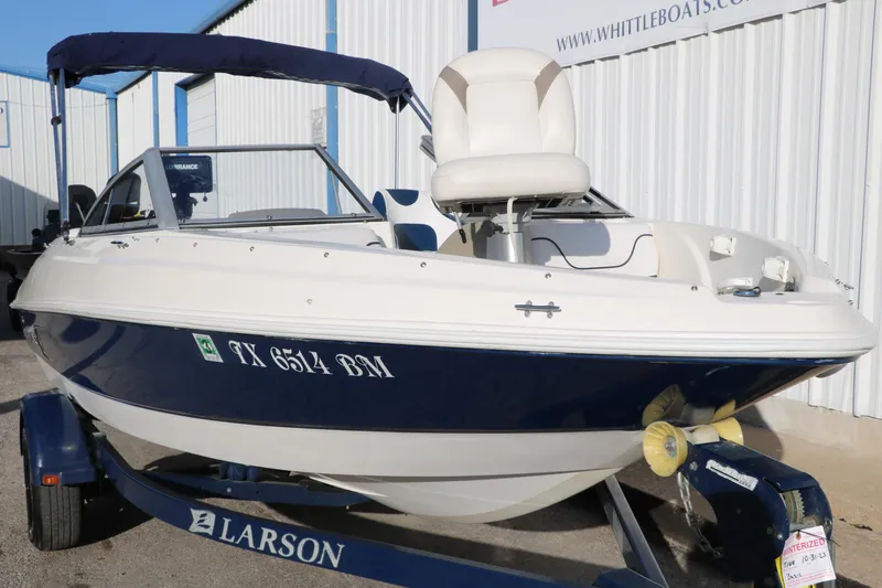 Slide: The Image of 2011 Larson LX850 Classic SF boat on trailer, blue and white exterior. - 10