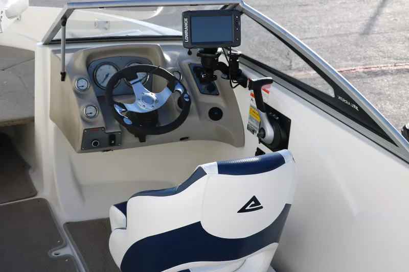 Slide: The Image of 2011 Larson LX850 Classic SF boat cockpit with steering wheel and navigation system. - 15