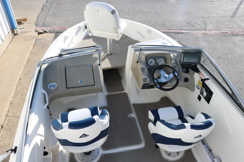 Slide: The Image of 2011 Larson LX850 Classic SF boat interior with dual seats and steering console. - 17