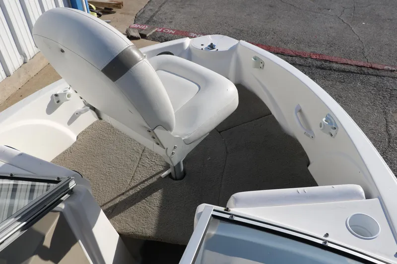 Slide: The Image of 2011 Larson LX850 Classic SF boat interior with white seating and carpeted floor. - 21