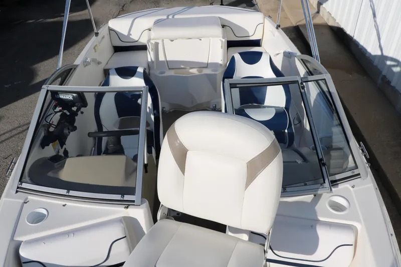 Slide: The Image of 2011 Larson LX850 Classic SF boat interior with white and blue seating. - 23