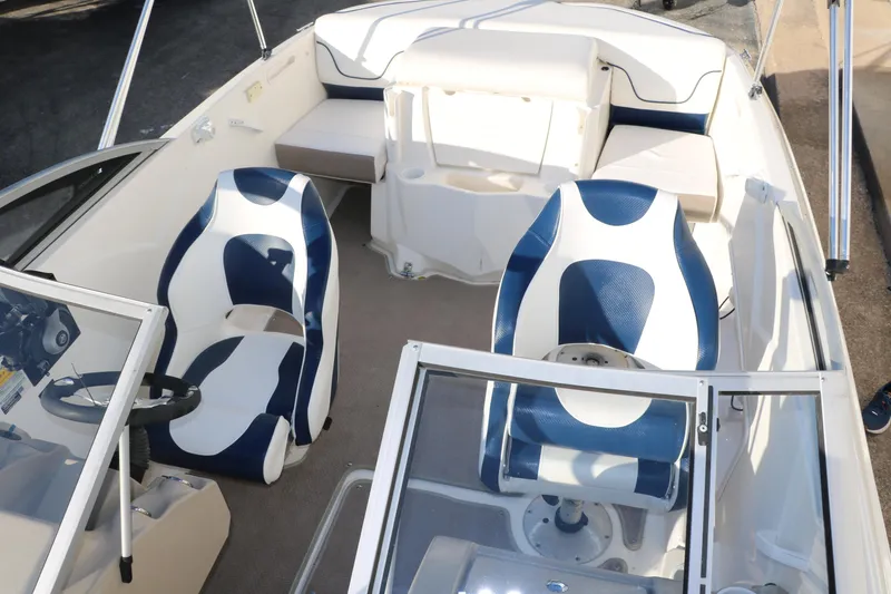 Slide: The Image of 2011 Larson LX850 Classic SF boat interior with blue and white seating. - 24