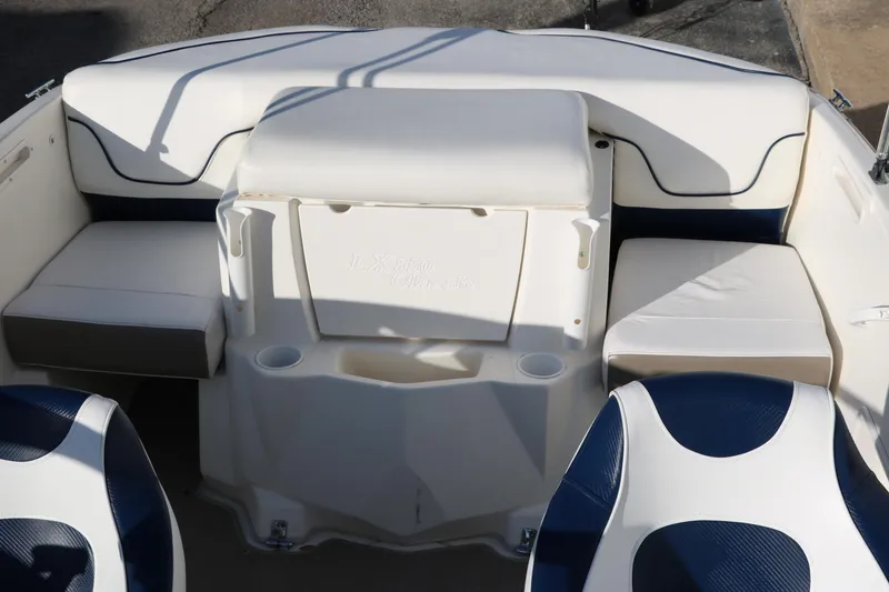 Slide: The Image of 2011 Larson LX850 Classic SF boat interior with white and blue seating. - 26