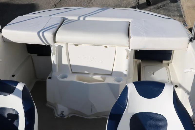 Slide: The Image of 2011 Larson LX850 Classic SF boat interior with white and blue seating. - 27