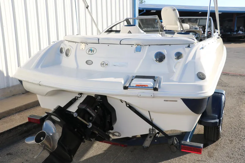 Slide: The Image of 2011 Larson LX850 Classic SF boat rear view with outboard motor. - 3