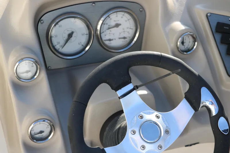 Slide: The Image of Steering wheel and dashboard of 2011 Larson LX850 Classic SF boat. - 31
