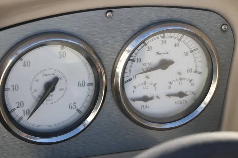 Slide: The Image of Close-up of Larson LX850 Classic SF 2011 boat dashboard gauges. - 34