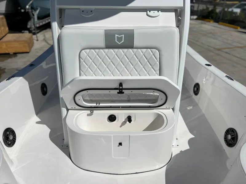 Slide: The Image of 2024 Sea Fox 251 Bay Fox boat, front deck view at a marina. - 10