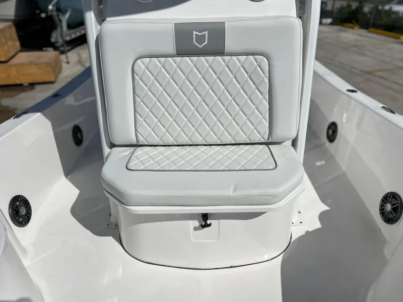 Slide: The Image of 2024 Sea Fox 251 Bay Fox boat, white interior, center console, docked. - 11