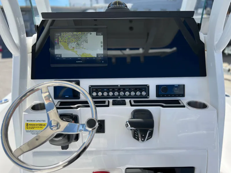 Slide: The Image of 2024 Sea Fox 251 Bay Fox boat with cushioned seating and modern design. - 20