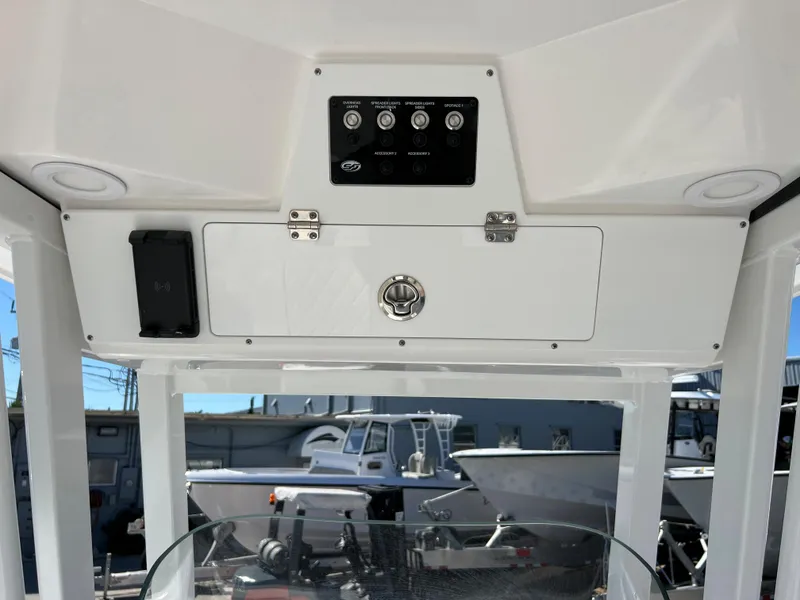Slide: The Image of 2024 Sea Fox 251 Bay Fox boat dashboard with navigation screen and steering wheel. - 23