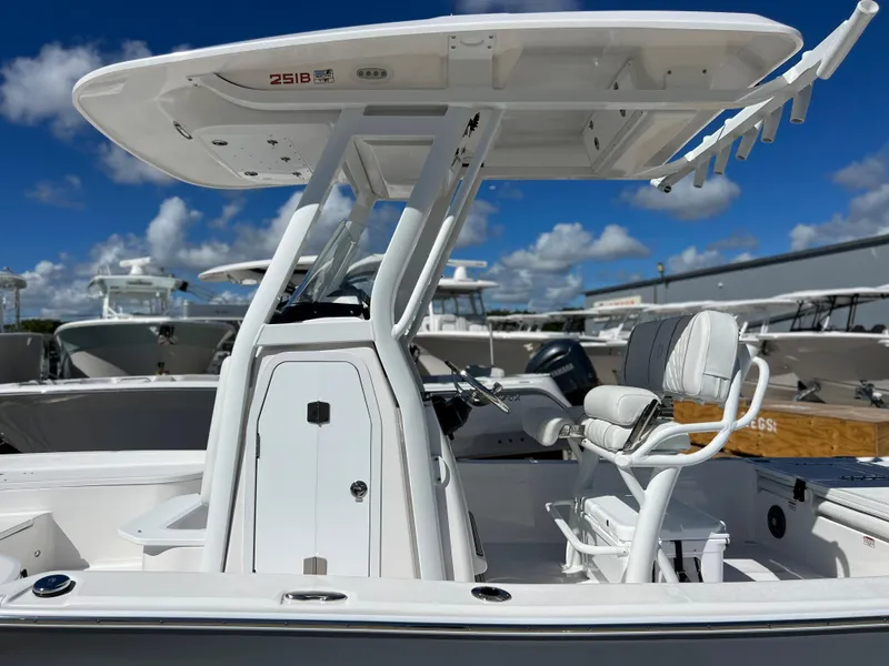 Slide: The Image of 2024 Sea Fox 251 Bay Fox boat interior with open console storage. - 35