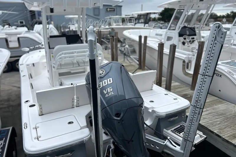 Slide: The Image of 2024 Sea Fox 251 Bay Fox boat with Yamaha 300 V6 engine at a marina. - 43