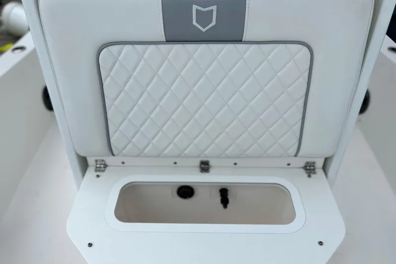 Slide: The Image of 2024 Sea Fox 251 Bay Fox boat seat with diamond-patterned upholstery and storage compartment. - 50