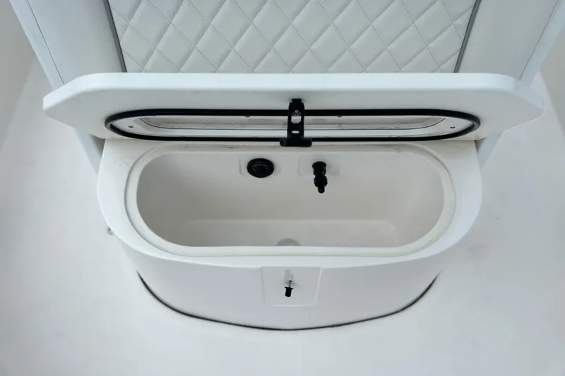 Slide: The Image of 2024 Sea Fox 251 Bay Fox boat livewell with open lid and quilted seat back. - 52