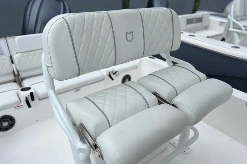 Slide: The Image of Luxurious seating on 2024 Sea Fox 251 Bay Fox boat, featuring diamond-stitched upholstery. - 54