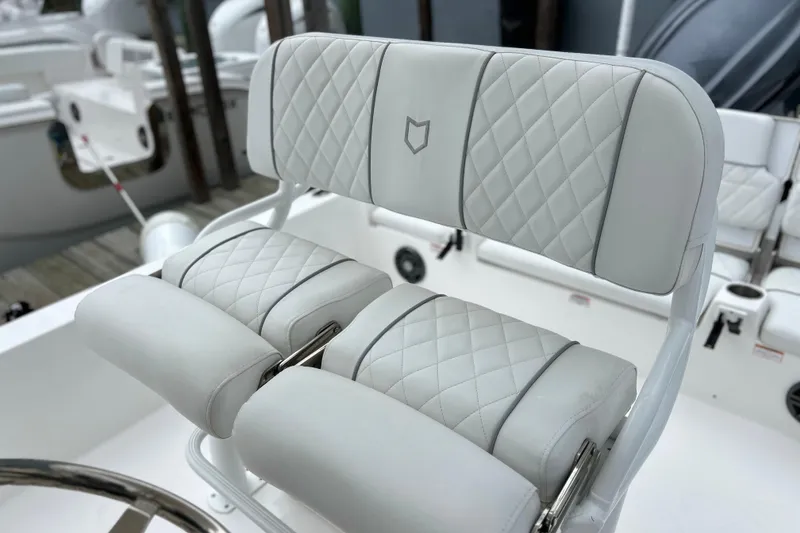 Slide: The Image of Luxurious seating on 2024 Sea Fox 251 Bay Fox boat with diamond-stitched upholstery. - 55