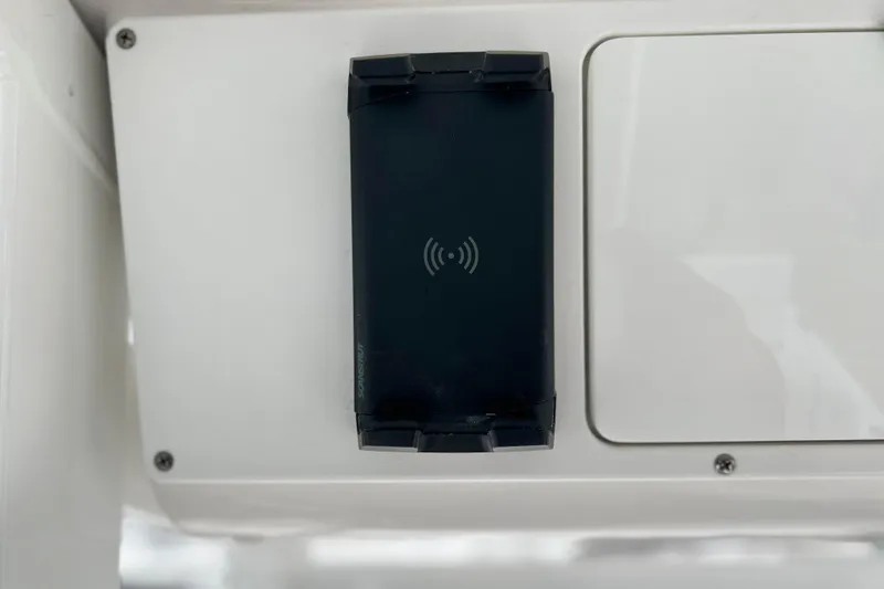 Slide: The Image of 2024 Sea Fox 251 Bay Fox wireless charging pad on white panel. - 58